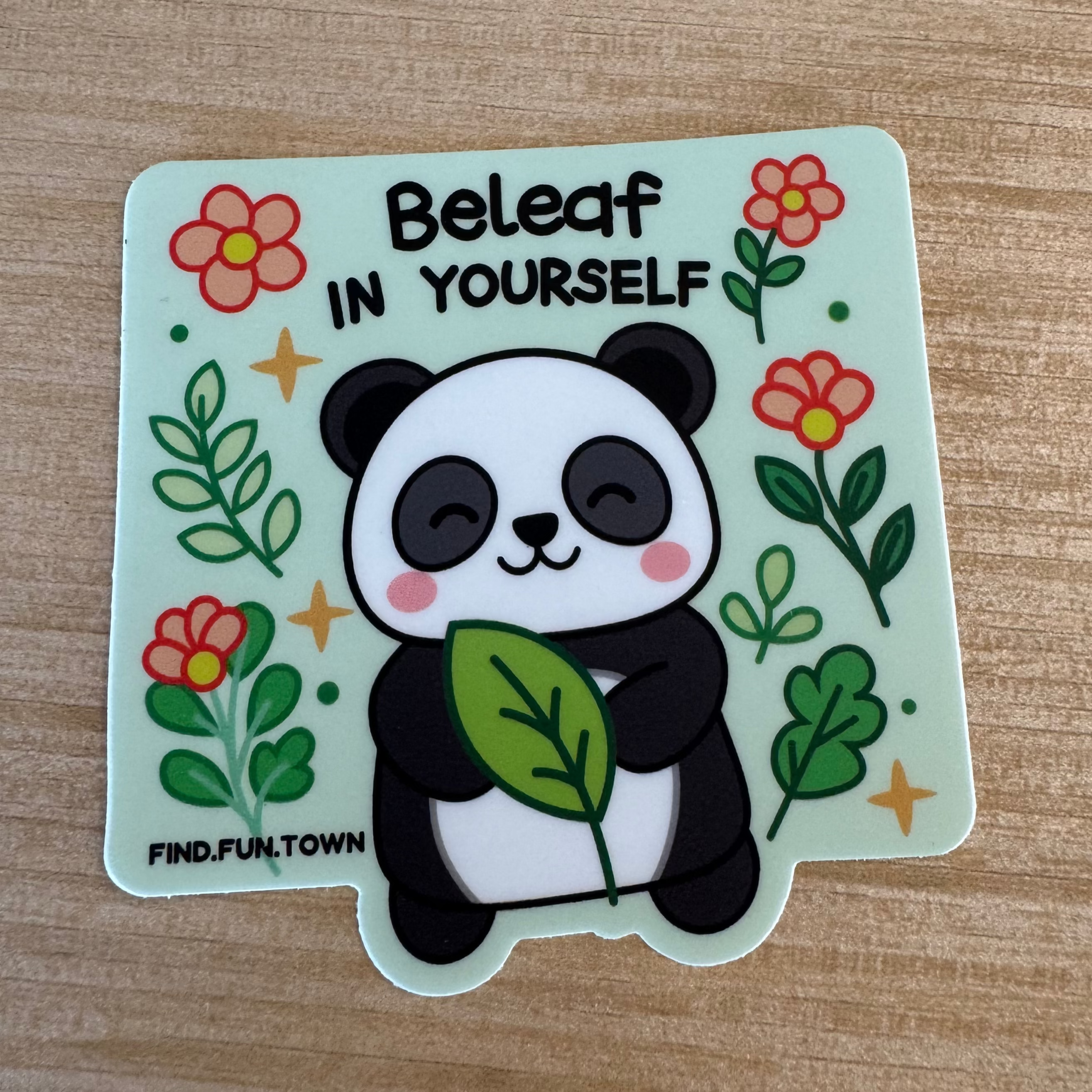 Sticker with a panda holding a leaf and flowers 